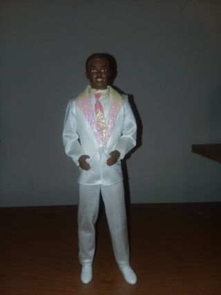 1980s Black Ken Doll " Jewel " With Pink Tie And White Suit And Shoes.