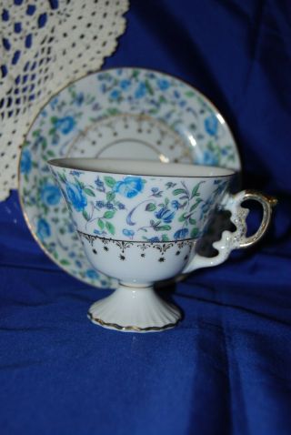 Vintage Chintz Tea Cup And Saucer 7022 Blue Rose Pattern Footed