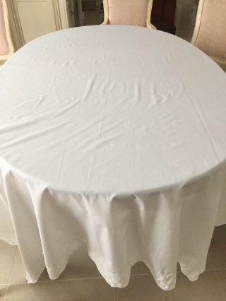 A Large Vintage White Cotton Tablecloth With Embroidered Edging