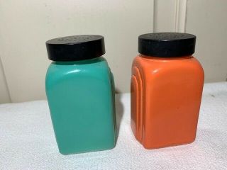 Vtg painted milk glass Salt & Pepper shakers orange & teal with black lids 3