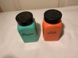 Vtg painted milk glass Salt & Pepper shakers orange & teal with black lids 5