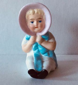 Antique Cute Small Bisque Girl Sitting With Pink Bonnet Figurine