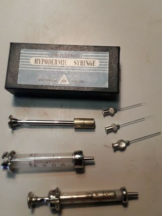 Two Vintage Hypodermic Syringes