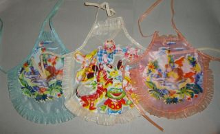 Vintage Plastic Doll Aprons Peter Pan And Toy Animals