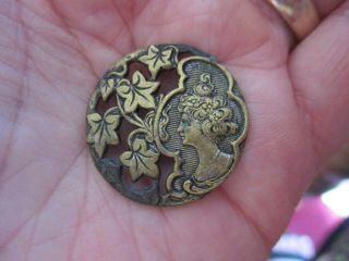 An Antique Art Nouveau Brass Flower Woman Button - 1 Inch Diameter.