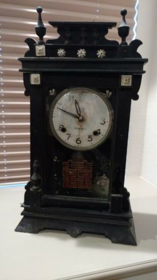 Antique Chinese Clock With Pendulum Cabinet Is Wooden And Painted Black