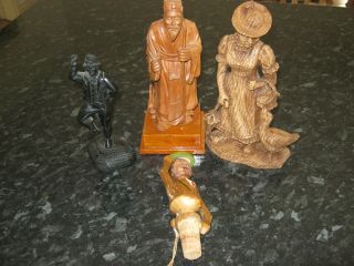 Four Old Carved Wooden Figures.