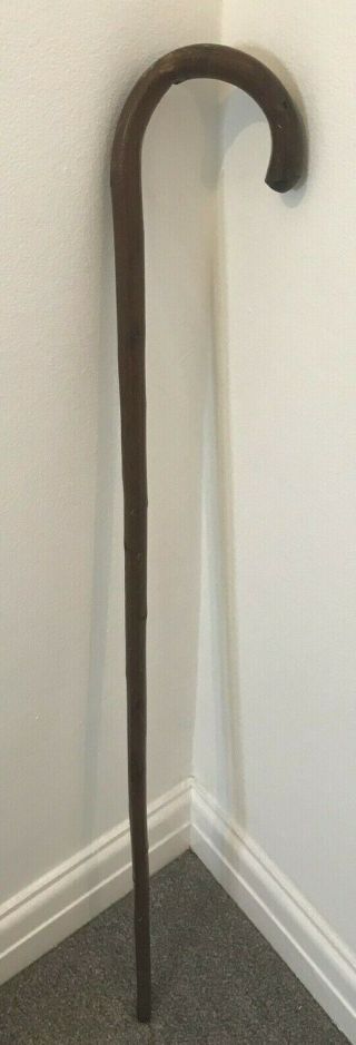 Solid Dark Brown Wooden Walking Stick With Curved Handle And Metal Tip Antique