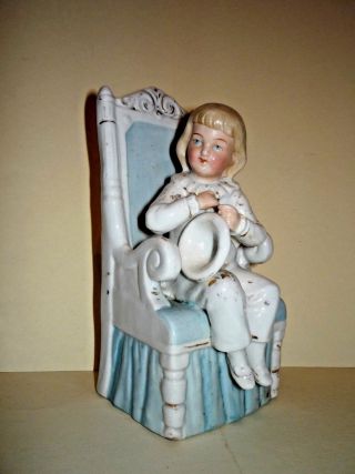 Antique Porcelain Figurine Of Boy In Chair
