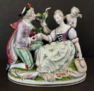 Hand Painted Porcelain Romantic Figurine Of Courting Couple With Cupid In Garden