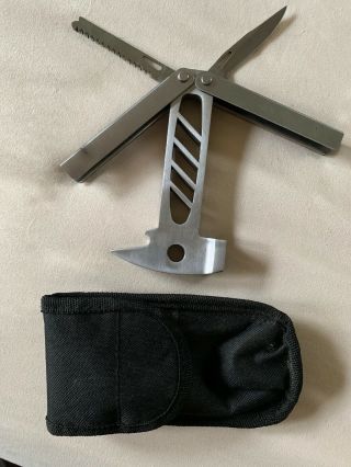 Multi Tool Small Claw Hammer On One End Knife Blade And Saw Blade On Other End