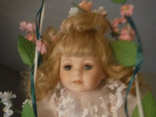 Vintage Unique Porcelain Doll Setting In A Swing Wearing Pink Dress White Lace