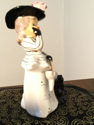 Vintage porcelain Lady with Dog figurines.  Unmarked.  Japan? 5