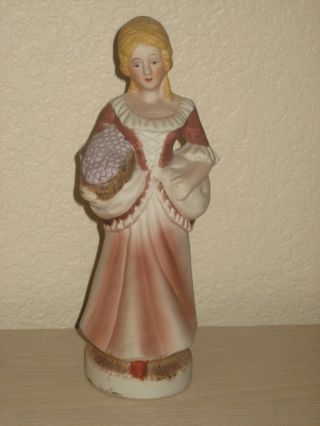 Flambro - Porcelain Lady In Two Tone Brown Dress Carrying Basket Of Grapes