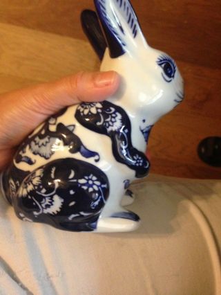 SET OF THREE BLUE AND WHITE HAND PAINTED CERAMIC BUNNY RABBITS AND 4