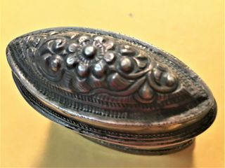 Oval two piece Thai metal box with decorated top and Thai inscriptions on bottom 2