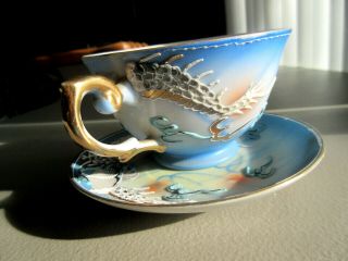 Tea Cup & Saucer,  Hand Painted,  Embossed Dragon,  Geisha Image Cup Bottom Occupied