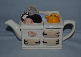 Vin.  Novelty Teapot Shaped Like A Stove,  On Top Is A Sleeping Kitty Keeping Warm