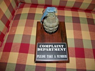 Complaint Deptartment.  Fake Grenade.  Take A Number.
