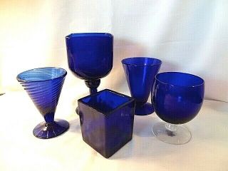 Set Of Four Cobalt Blue Glasses In Various Shapes And Square Candleholder