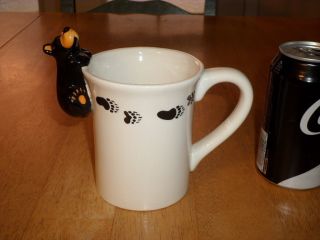 [3 - D] Black Bear Hanging On To Top Rim & Bear Paw Prints,  Ceramic Coffee Mug/cup
