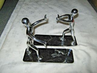 A Mid Century Modern Chrome Metal Mannequin Figural Bookends