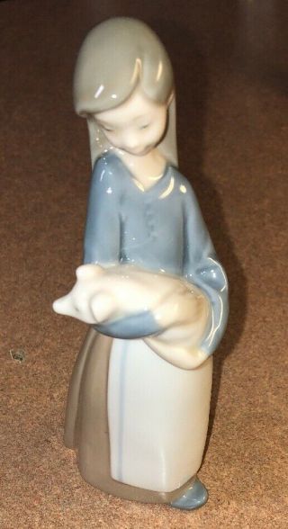 Lladro 1011,  Girl With Pig (girl Holding Pig)