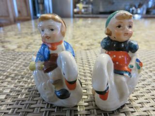 Vintage Dutch Boy And Girl Riding Swans Salt & Pepper Shakers