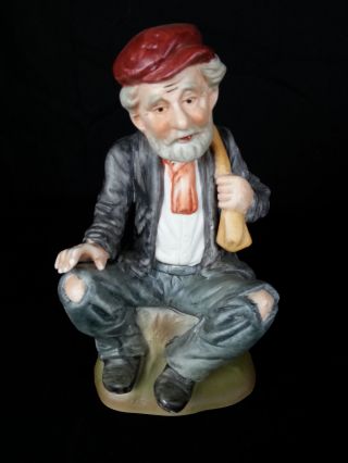 Porcelain Bisque Hand Painted Old Man Hat Sitting Holding Sack Over His Shoulder
