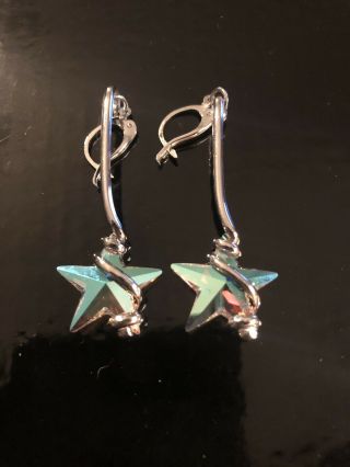 Silver Metal Pierced Earrings With Crystal Star