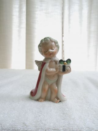 Vintage Porcelain Angel Figurine Baby Boy Holds Present Jewelry Industry Council