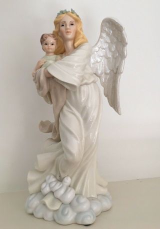 Porcelain Figurine Of Angel Holding Baby Muted Colors 10 " Tall