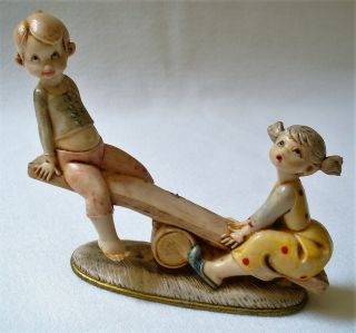 Vintage Depose Italy Plastic Figural Boy And Girl On Teeter Totter Collectible