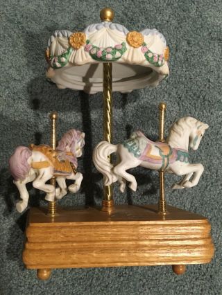 Ceramic Carousel Horse Music Box.  Plays Carousel Waltz.  Wood Base 10” Tall