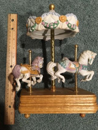 Ceramic Carousel Horse Music Box.  Plays Carousel Waltz.  Wood Base 10” Tall 2