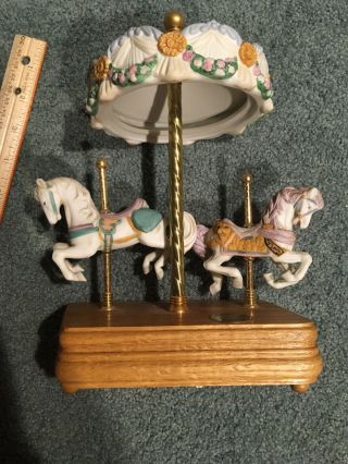 Ceramic Carousel Horse Music Box.  Plays Carousel Waltz.  Wood Base 10” Tall 4