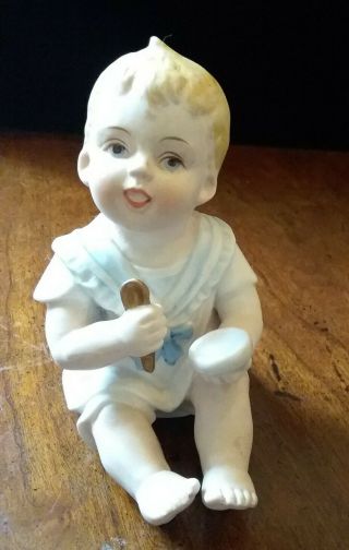 Vintage Bisque Porcelain Piano Baby Boy Figurine Bowl Spoon Figurine.