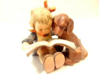 Goebel Hummel figurine: Young girl reading to her dog; 1st Millennium 2000 issue 2