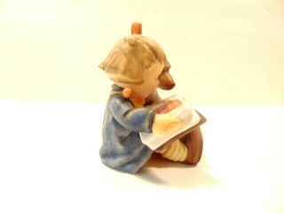 Goebel Hummel figurine: Young girl reading to her dog; 1st Millennium 2000 issue 3