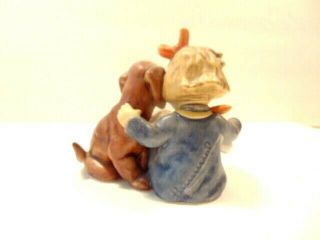 Goebel Hummel figurine: Young girl reading to her dog; 1st Millennium 2000 issue 4