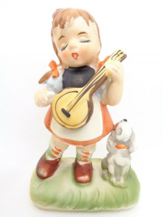 Vintage Ceramic Bisque Figurine Little Girl Playing Banjo & Her Singing Dog