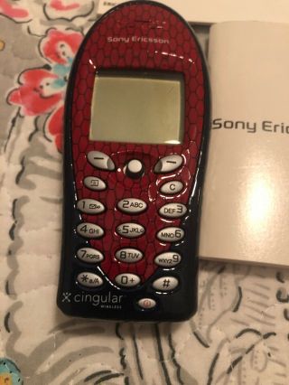 Sony Ericsson Cellular Phone And Spider - Man Case.  Cingular Wireless