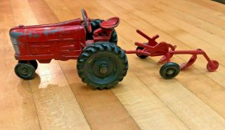 Vintage Red Metal Toy Tractor And Plow,  1950s