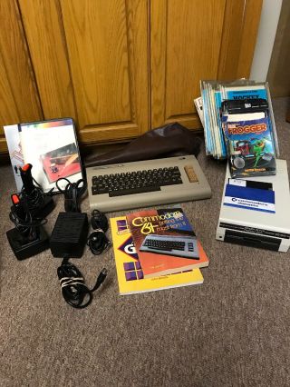 Commodore 64 Computer With Floppy Disk Drive Etc.