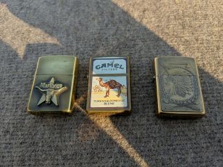 3 Vintage Brass Zippo Lighters Marlboro,  Camel,  Indian