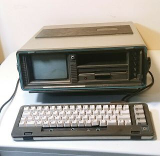 Commodore Sx - 64 Vintage Computer With Keyboard,  Cables,  And Floppy Disks