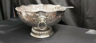 A Large Antique Silver Plated Punch Bowl With Floral Embossed Patterns.