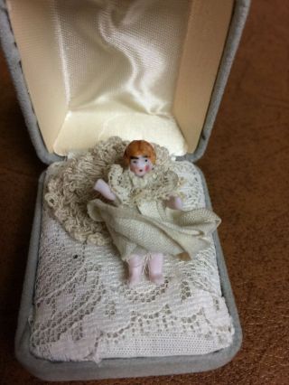 Antique Tiny Miniature 1 3/4 " Bisque Doll Wire Jointed Arms.  Jewelry Box Bed.