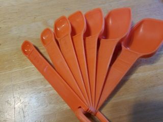 Vintage TUPPERWARE Set of 7 Orange Nested Measuring Spoons 2