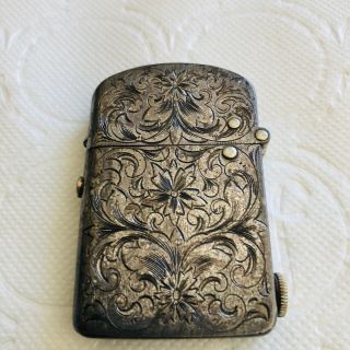 NASSAU Dec.  26,  1905 push button lighter.  Sterling Silver chased and monogramed. 2